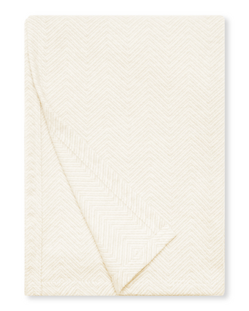 Cream-colored shawl with herringbone weave pattern, folded to show texture and drape.5