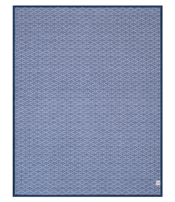 Blue blanket with repeating white scallop wave pattern and dark blue border.7