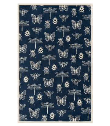 Navy blanket with cream insect pattern featuring butterflies, dragonflies, beetles, and bees.6