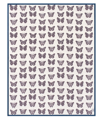 Cream blanket with repeating purple butterfly pattern and navy blue border.7