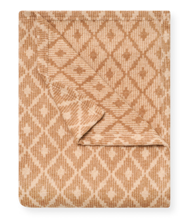 Tan and cream blanket with diamond quilted pattern and ribbed texture, shown folded.