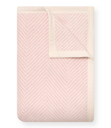 Pink and cream herringbone patterned midi blanket with folded corner detail.1
