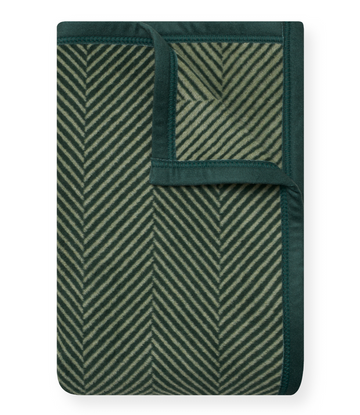 Forest green midi blanket with herringbone pattern in cream and dark green stripes, solid border trim.1