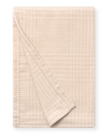 Oatmeal-colored plaid shawl with textured weave, displayed folded diagonally.5