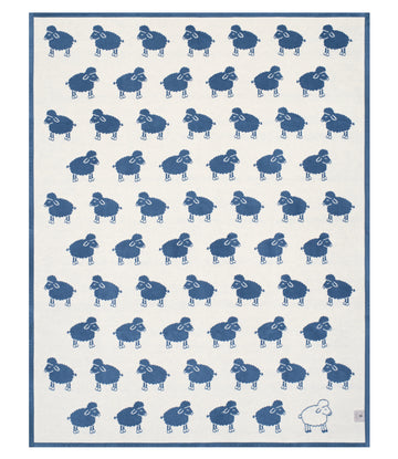 Blue and cream blanket with repeated sheep pattern and navy border.6