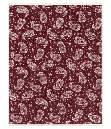 Burgundy blanket with cream paisley and floral motifs throughout.6